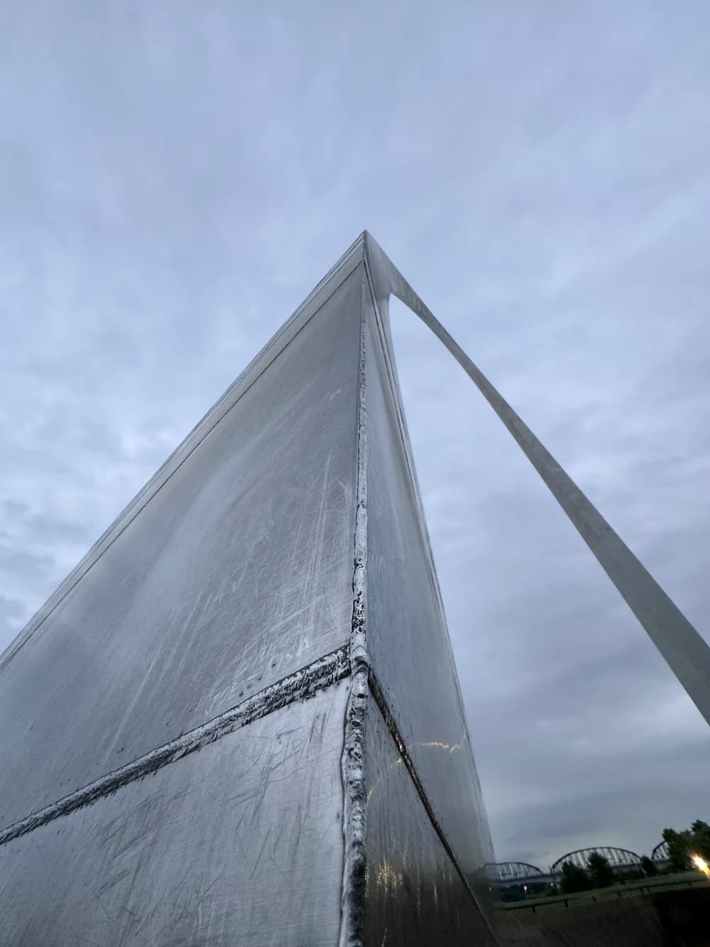 Looking up along the stainless-steel surface of the Gateway Arch in St. Louis.